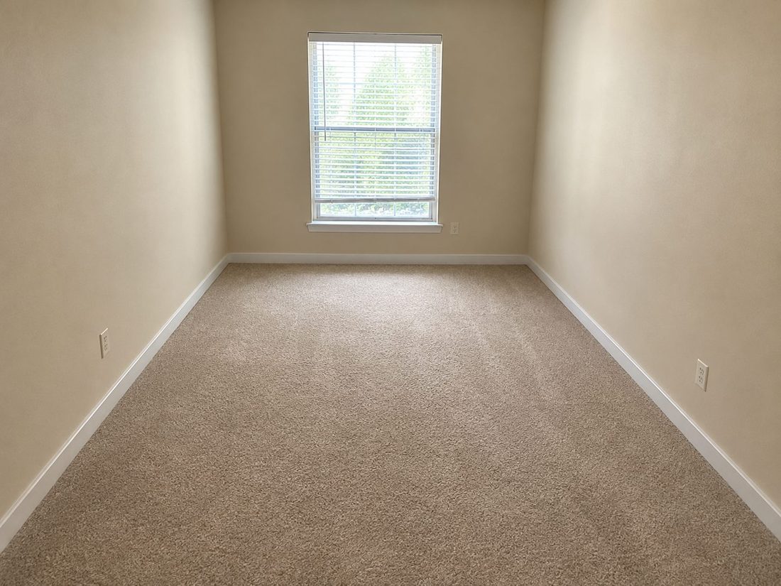 After: the same room cleared and vacuumed, move-in ready for the next tenant
